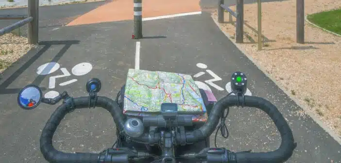 a bicycle with a map on the handlebars