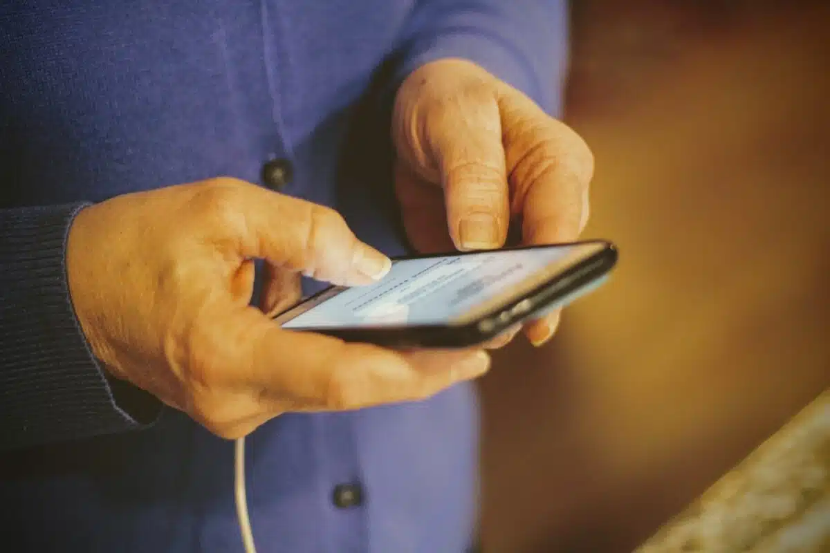 person holding silver iphone 6